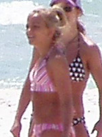 Britney Spears in pink bikini relaxing..