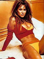 Brooke Burke posing for this gold glamour