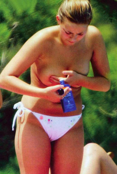 Celebrity Charlotte Church topless sunbathing on a beach. Photo #9.