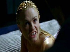 Anna Paquin rolling over in bed while