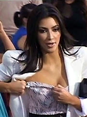 Kim Kardashian cleavage as she fixing her