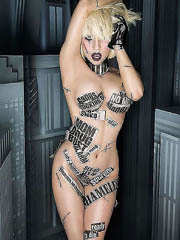 Lady Gaga oops flashes boob slip as she..