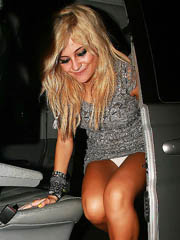 Pixie Lott oops upskirt while exiting..